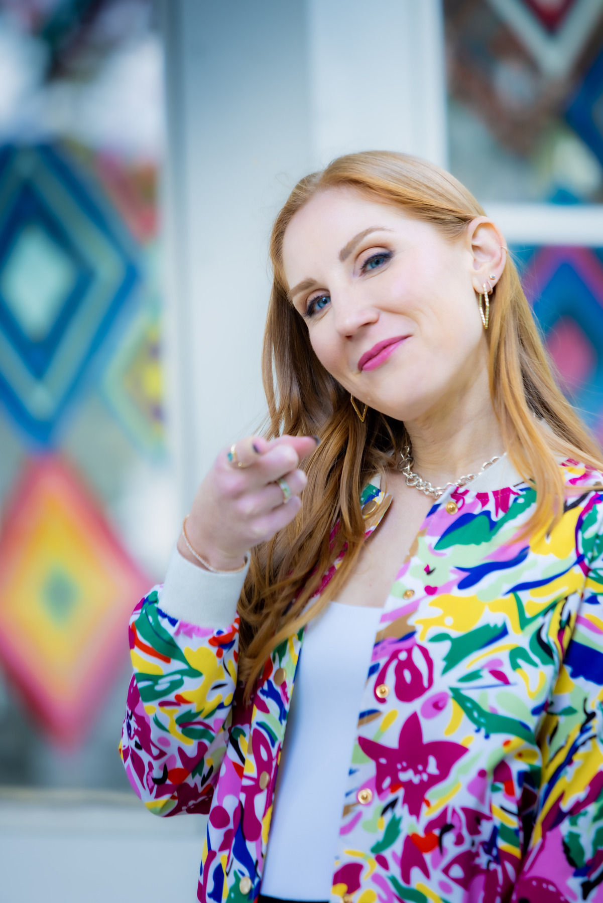 Laryssa Wirstiuk Pointing at JoyDeck Members